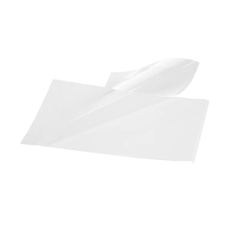 White tissue paper laid flat with a curled edge on a white background, showing a thin, translucent sheet